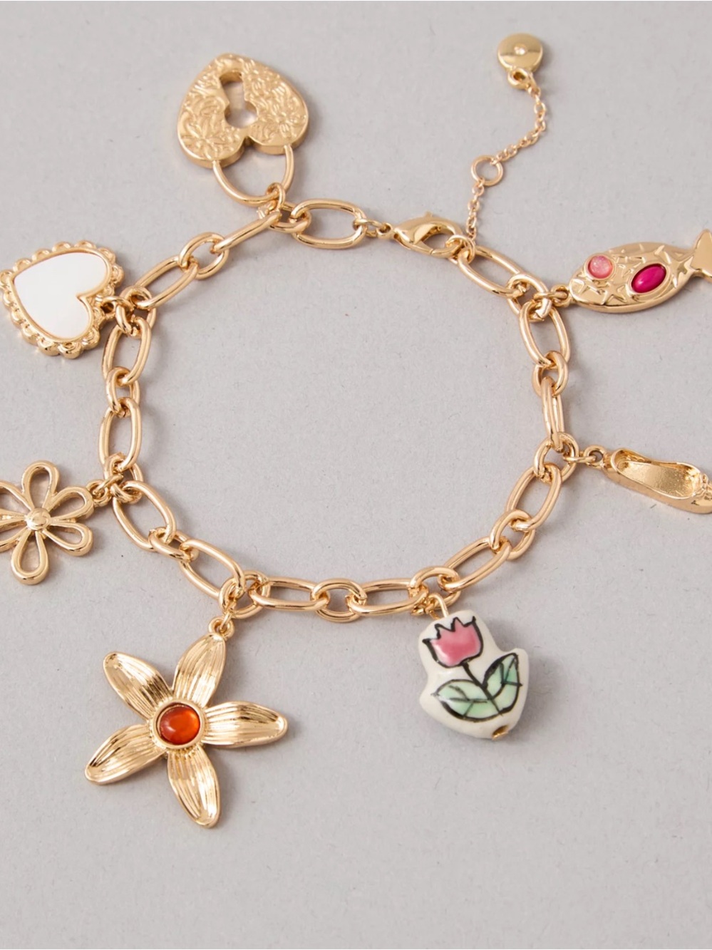 Gold-Tone Floral Charm Bracelet with Pink Tulip Fish and White Enamel Accents